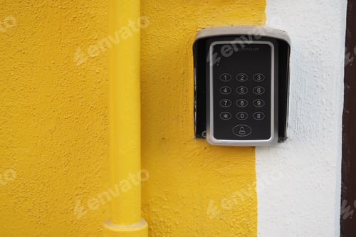 Preview: Access control system mounted on a yellow wall