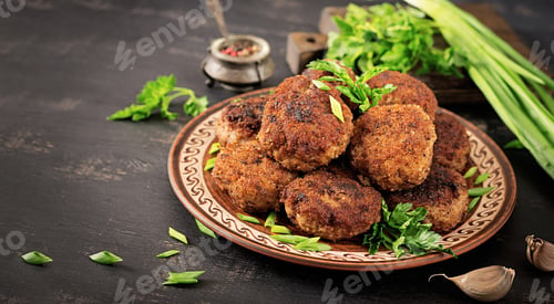 Preview: Juicy delicious meat cutlets on a dark table. Russian cuisine.