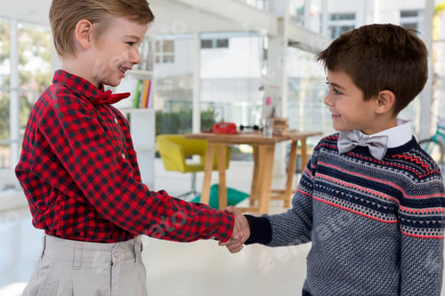 Preview: Kids as business executives shaking hands