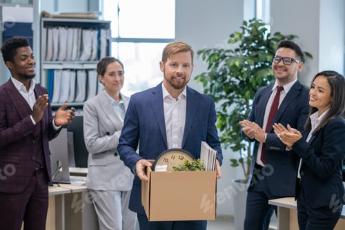 Preview: Group of intercultural colleagues clapping hands to new employee
