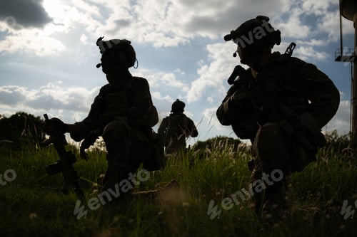 Preview: Special forces soldier in camouflage with a pair of weapons that are full of modern technology