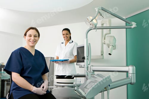 Preview: A female dentist and dental nurse