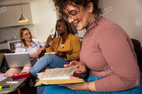 Preview: Portrait of female student learning at home with her friends.