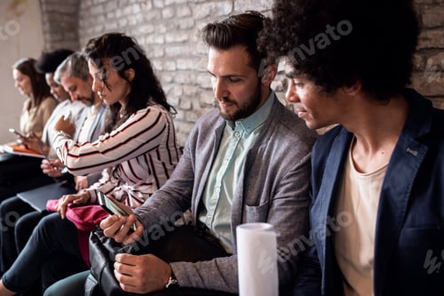 Preview: Business people waiting for job interview.