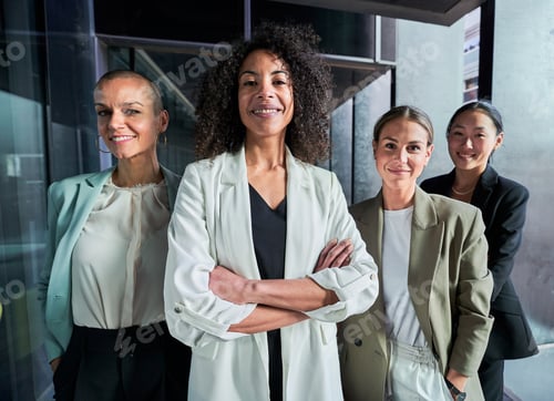 Preview: Four multiracial empowered women looking at camera confident and cheerfully at the office.