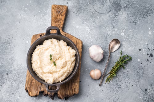 Preview: Overhead shot of a white savory condiment (aioli or horseradish) with a spoon