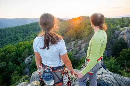 Preview: Couple of climbers resting and enjoying beautiful nature view
