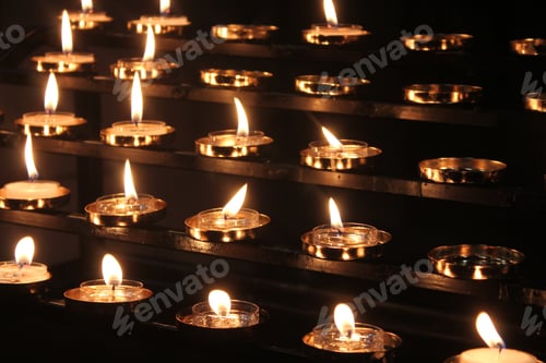 Preview: Lit rows of golden Candles in St. Patrick's cathedral