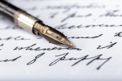 Preview: Writing with a fountain pen on a paper surface during daytime hours