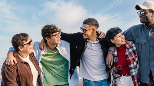 Preview: Multiracial Group of Friends Embracing Outdoors