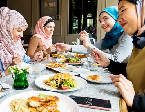 Preview: Islamic women friends dining together with happiness