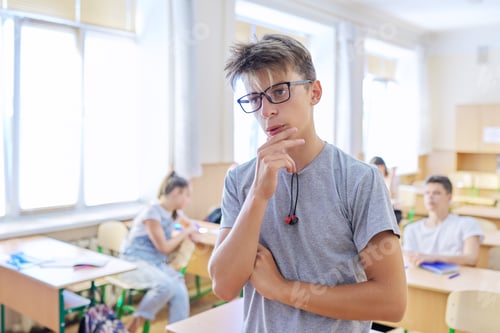 Preview: Smart teenager student male taking exam, answers lesson