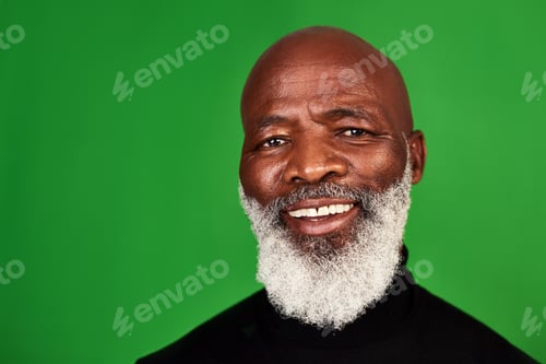 Preview: Its important to never stop smiling. Studio shot of a senior man posing against a green background.