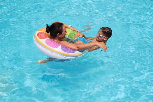 Preview: A shared smile in blue waters; holiday moments cherished. Aligns with the trend of experiential