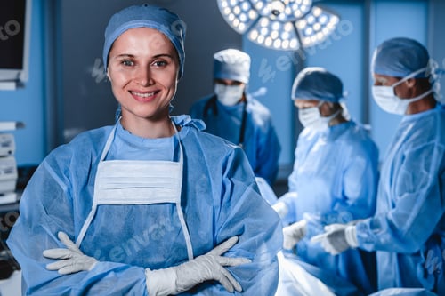 Preview: Portrait of smiling female surgeon with operation in background.