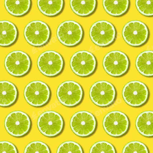 Preview: Green lime slices pattern on yellow color background, minimal flat lay food texture