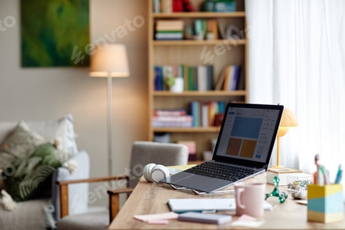 Preview: Modern Laptop Sitting on Wooden Desk in Cozy Home Office Environment