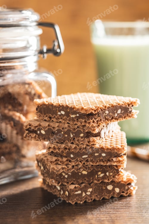 Preview: Sweet chocolate wafer on wooden table.