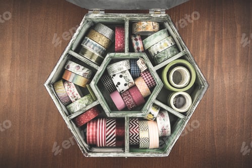 Preview: Top view of colorful various washi tape rolls collection in a vintage wooden box
