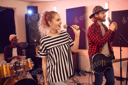 Preview: Beautiful Young Woman Singing with Band