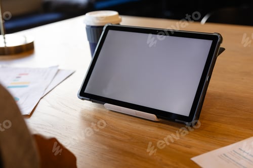 Preview: Tablet with copy space on screen on desk in office