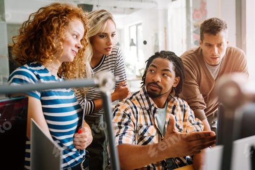 Preview: Diverse business colleagues gather in boardroom brainstorm discuss financial statistics together