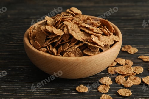 Preview: Bowl of tasty muesli on wooden background