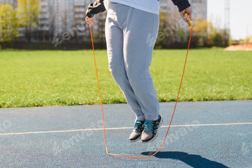 Preview: Fitness, aerobics and weight loss concept. Overweight woman jumping rope, sportswoman exercising
