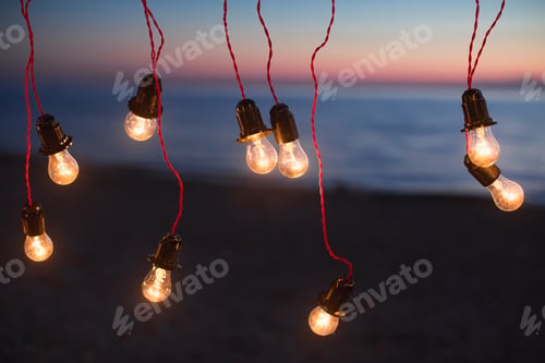 Preview: Lights and lights at night against the background of the ocean. Bokeh