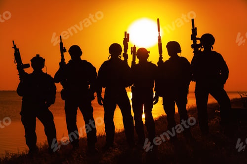 Preview: Army soldiers with rifles orange sunset silhouette