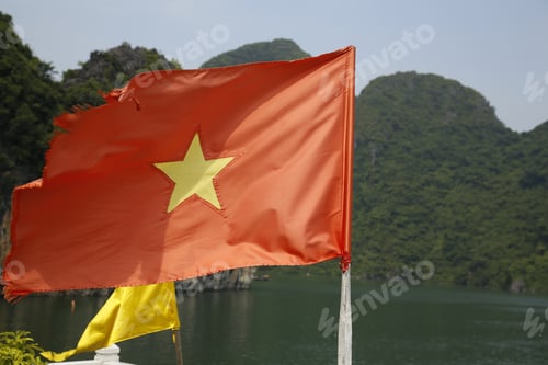 Preview: Halong Bay, Vietnam »; August 2017: The flag of Vietnam on a ship in Ha-Long Bay