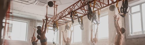 Preview: Team of sporty people training in fitness club