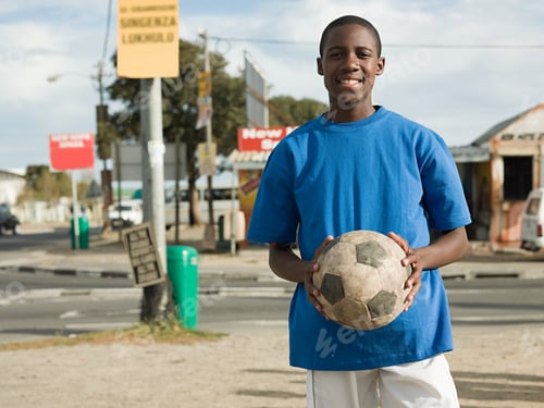 Preview: Teenage african boy with football