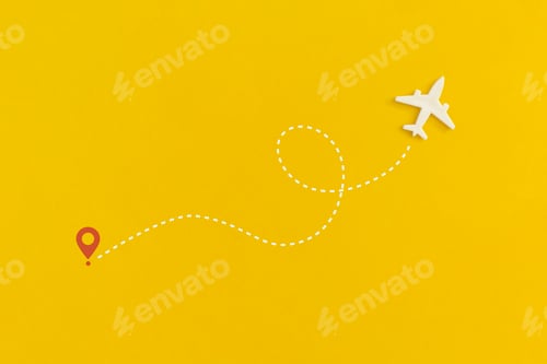 Preview: Toy airplane on a yellow background. Top view. Flat lay.
