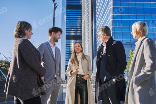 Preview: A group of business people from a company led by an empowered woman.