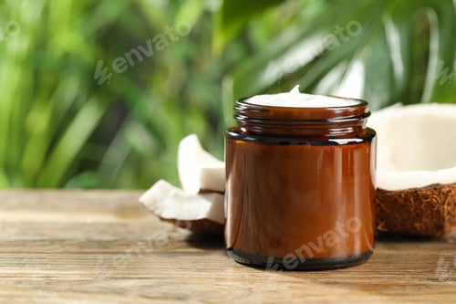 Preview: Jar of hand cream and coconut on wooden table, space for text