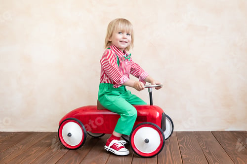 Preview: Happy child riding vintage car