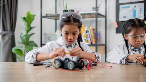 Preview: Asian students learn at home in coding robot cars and electronic board cables in STEM, STEAM,