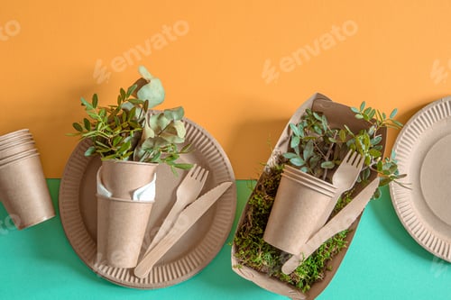 Preview: Eco-friendly, disposable, recyclable tableware on a colored background .