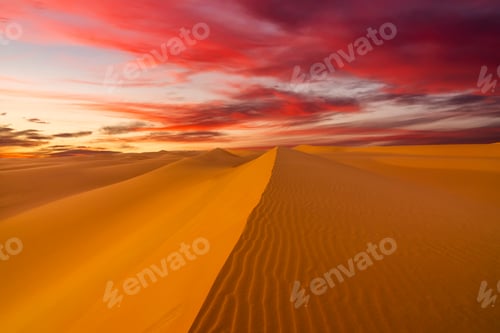 Preview: Sunset over the sand dunes in the desert. Arid landscape of the Sahara desert