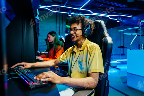 Preview: Multiethnic group of young friends playing videogames