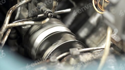 Preview: Close-up of rotating part of generator. Clip. Cylindrical part of engine rotates rapidly. Working