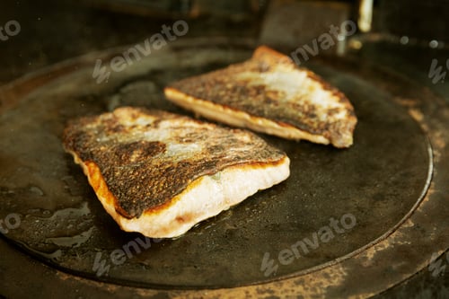 Preview: Close up of a pan-fried fillet of fish with crispy skin.