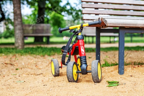 Preview: Small children's bike is on the playground. The concept of child