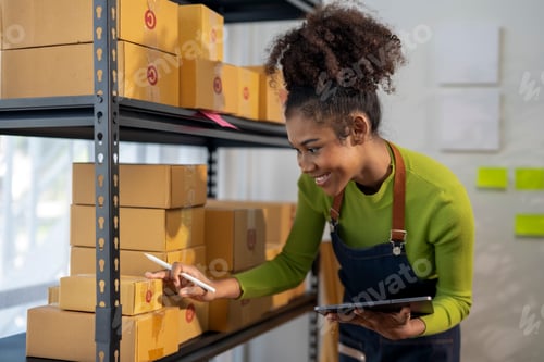 Preview: A woman is looking at a box on a shelf