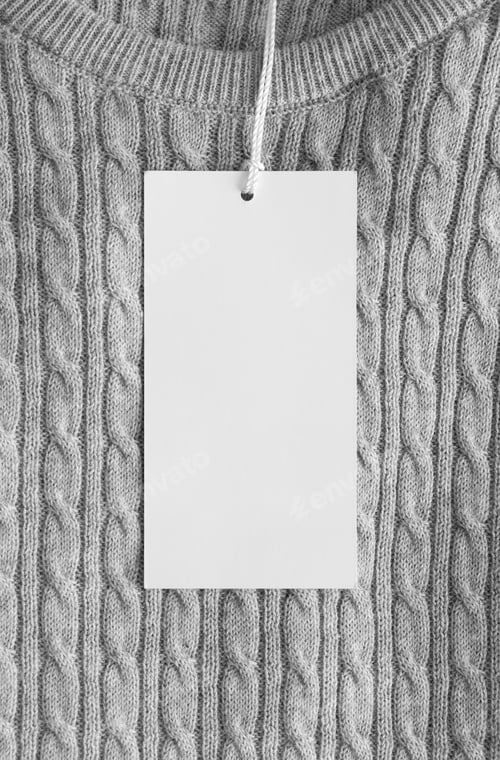 Preview: White clothing tag mockup on the grey sweater.