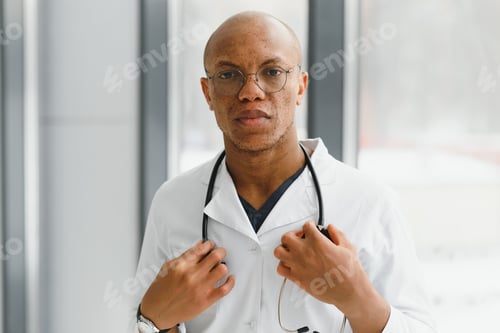 Preview: young male african doctor in hospital.