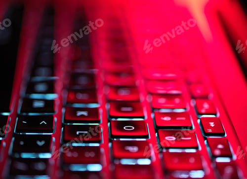Preview: Night-lit laptop computer focusing on the keyboard