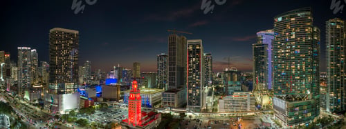 Preview: View from above of brightly illuminated skyscraper buildings in downtown district of Miami