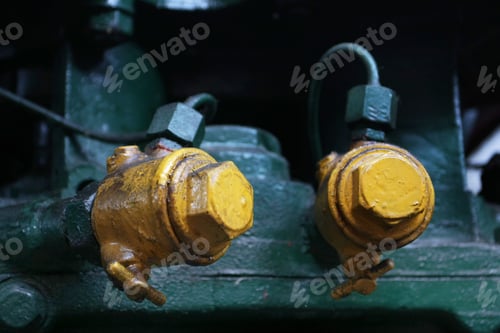 Preview: Large Yellow Bolts On Pipes